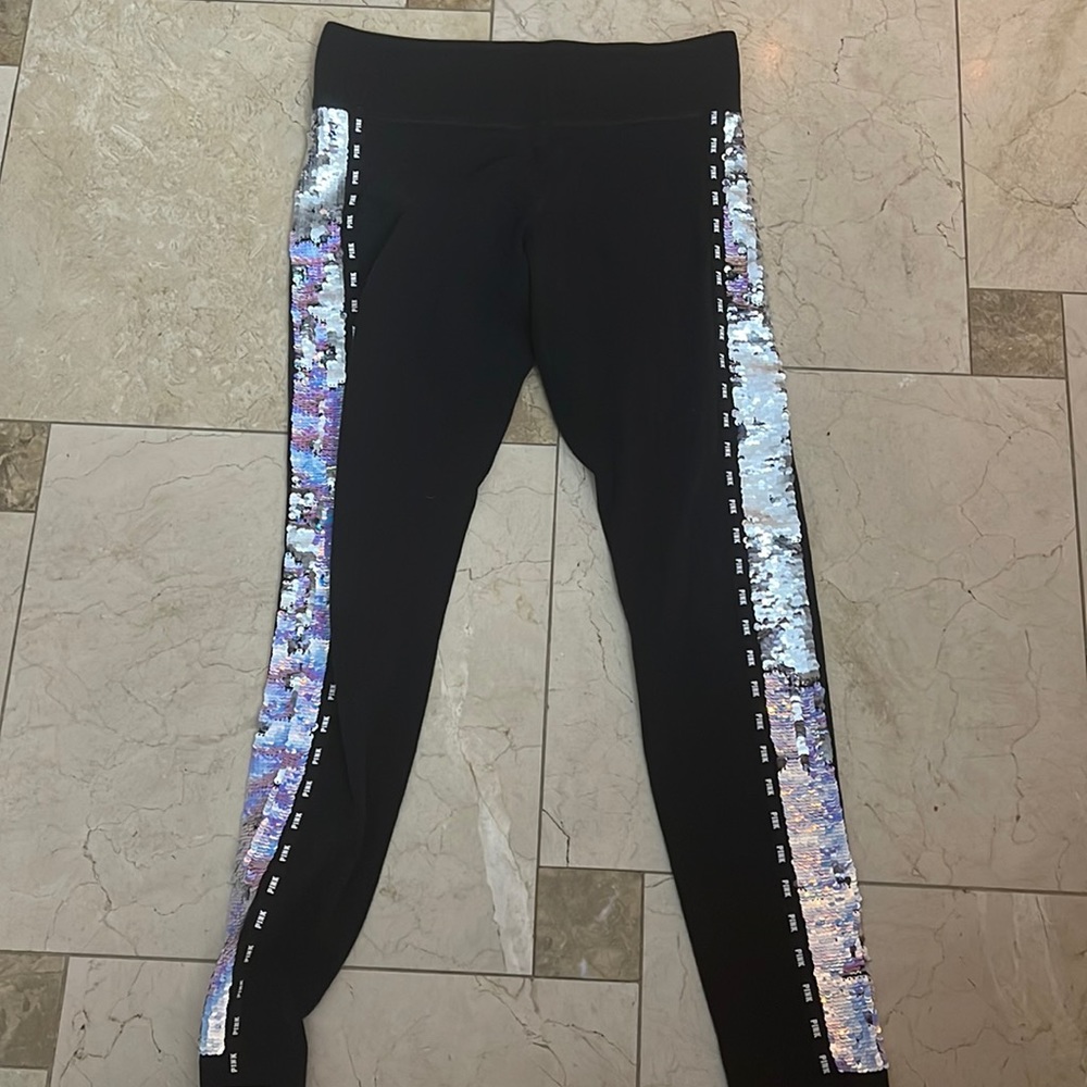 Black leggings from pink. Has sequence on both sides of the leg